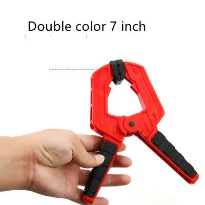 Tool steel woodworking clamp in double colour finish, 7 inch size, on a workbench