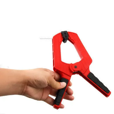 Tool steel woodworking clamp in double colour finish, 7 inch size, on a workbench