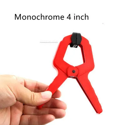 Tool steel woodworking clamp in double colour finish, 7 inch size, on a workbench