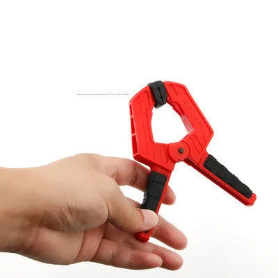 Tool steel woodworking clamp in double colour finish, 7 inch size, on a workbench
