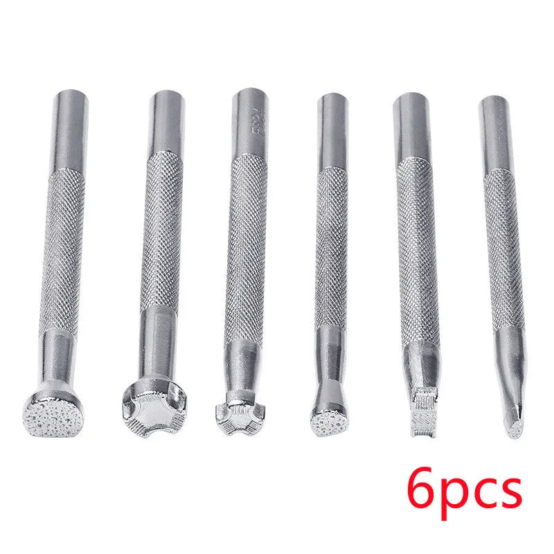 Set of six alloy leather carving printing sticks arranged on a workbench, tools for stamping and embossing