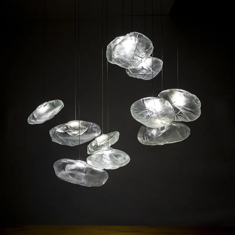 Postmodern style fabric chandelier with glass shade, shown in amber, clear, and smoke grey colours.