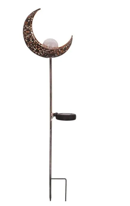 LED solar flame light with warm white glow in a garden, featuring iron and glass construction and stake stand
