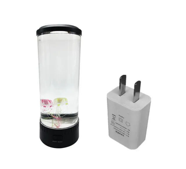Black jellyfish LED light with acrylic shade on a desk, 35cm tall, USB powered