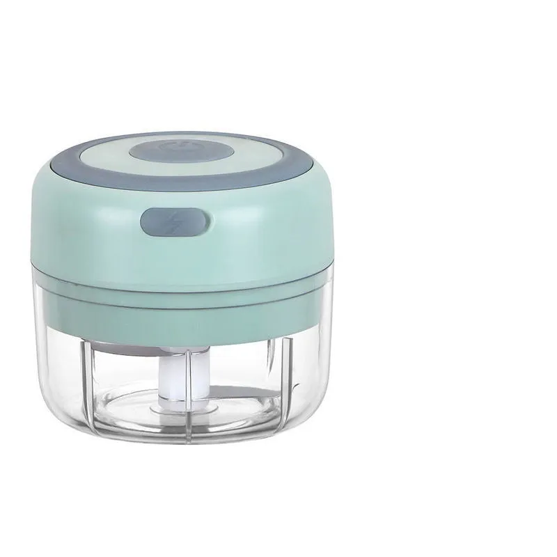 Mini electric garlic chopper with stainless steel blade and USB charging cable in green colour
