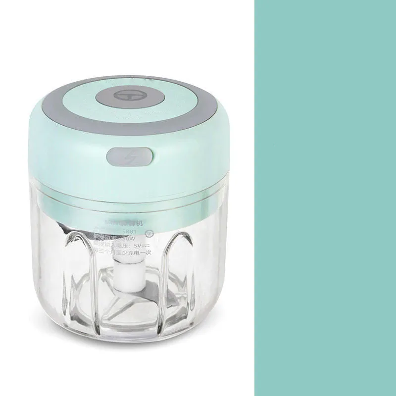 Mini electric garlic chopper with stainless steel blade and USB charging cable in green colour