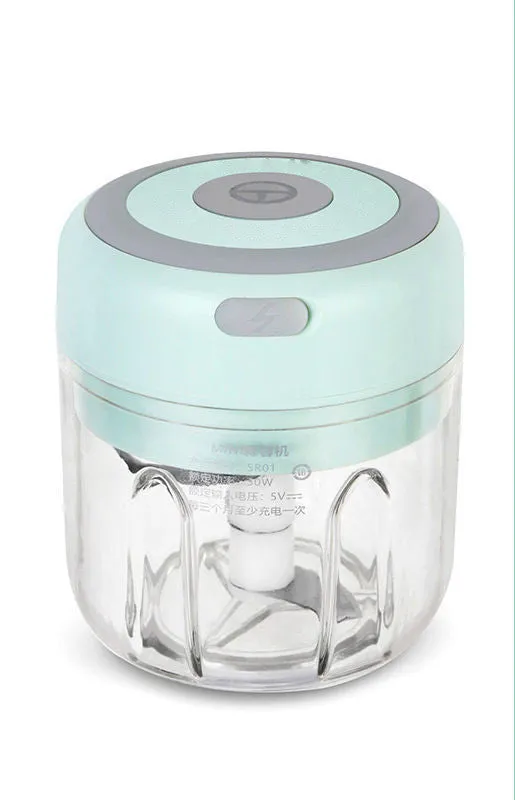 Mini electric garlic chopper with stainless steel blade and USB charging cable in green colour