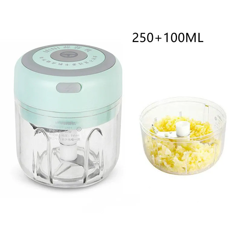 Mini electric garlic chopper with stainless steel blade and USB charging cable in green colour