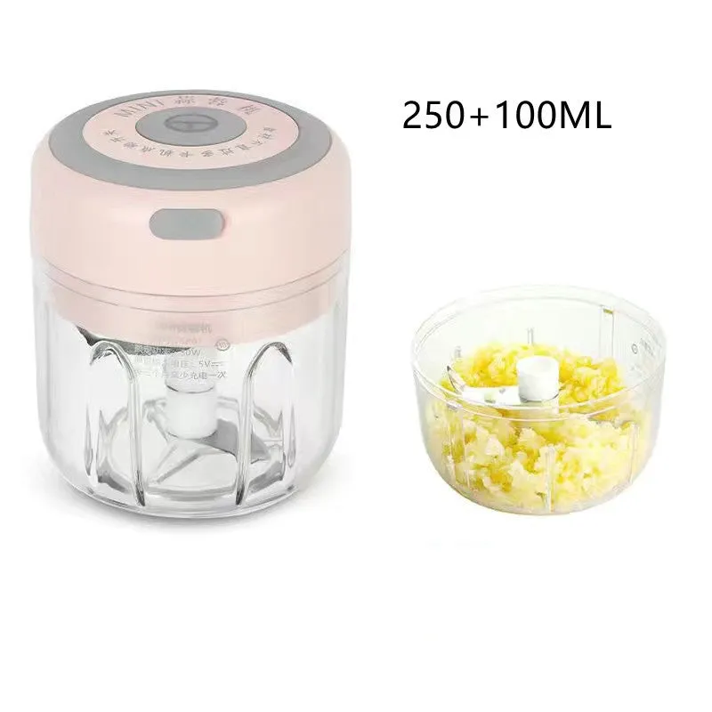 Mini electric garlic chopper with stainless steel blade and USB charging cable in green colour