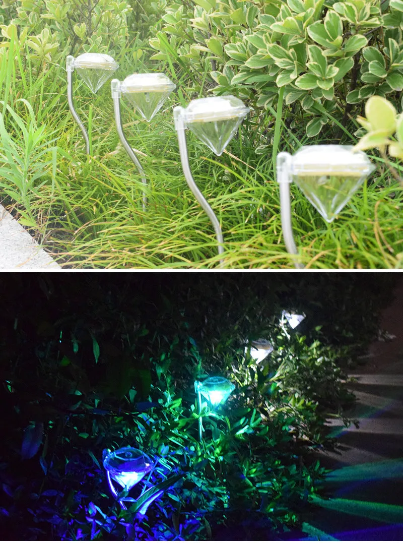 White solar-powered garden spotlight with adjustable lighting angle on a fence post.
