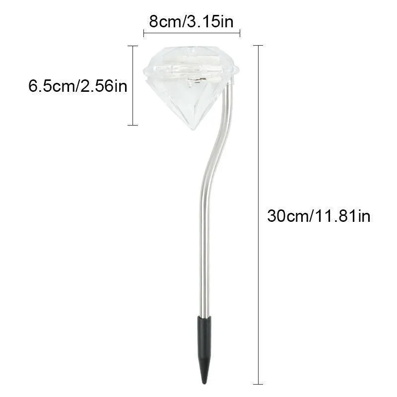 White solar-powered garden spotlight with adjustable lighting angle on a fence post.