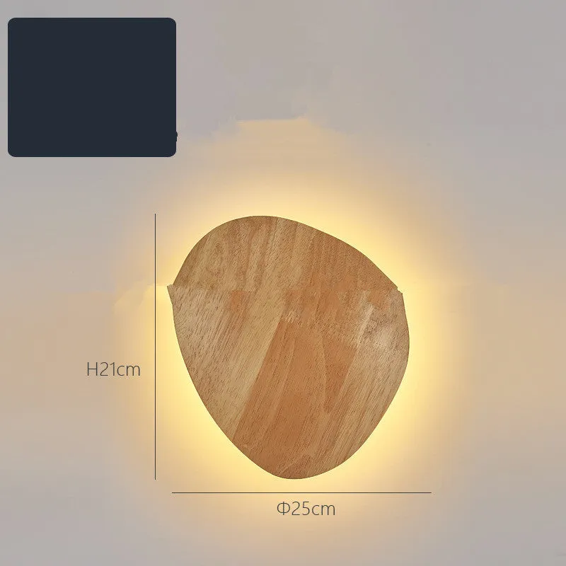 Log Art wood LED wall lamp with oval shape and warm light on a white wall