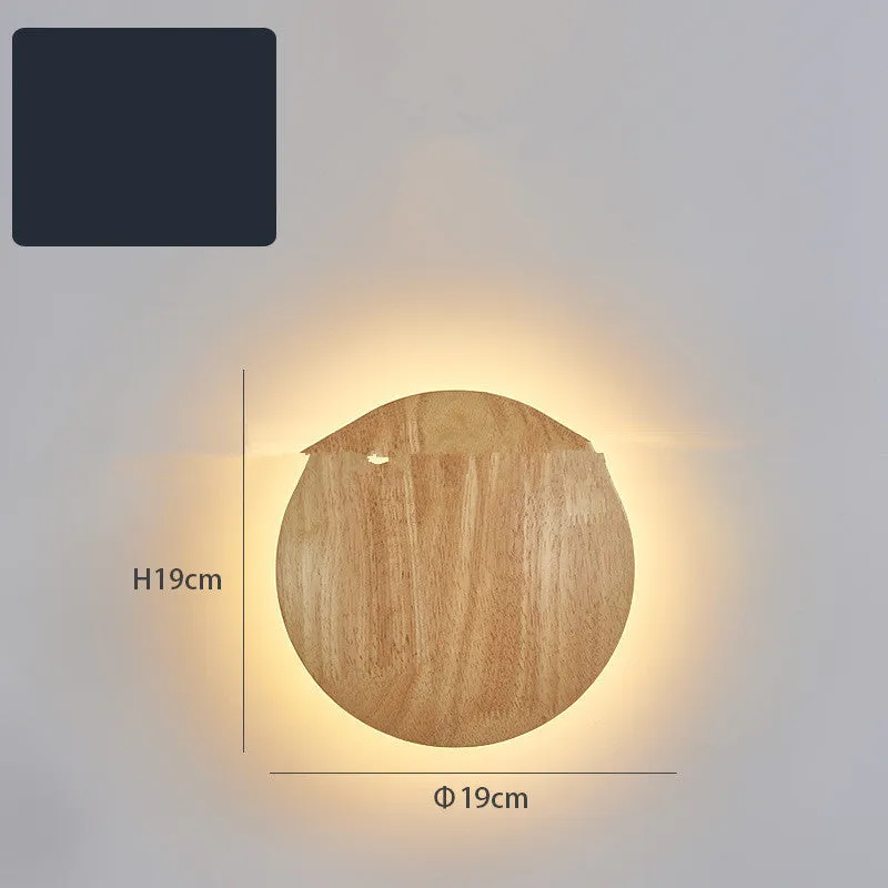 Log Art wood LED wall lamp with oval shape and warm light on a white wall