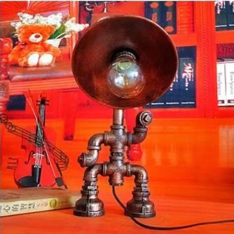 Industrial retro style water pipe robot table lamp made of iron in a vintage colour.