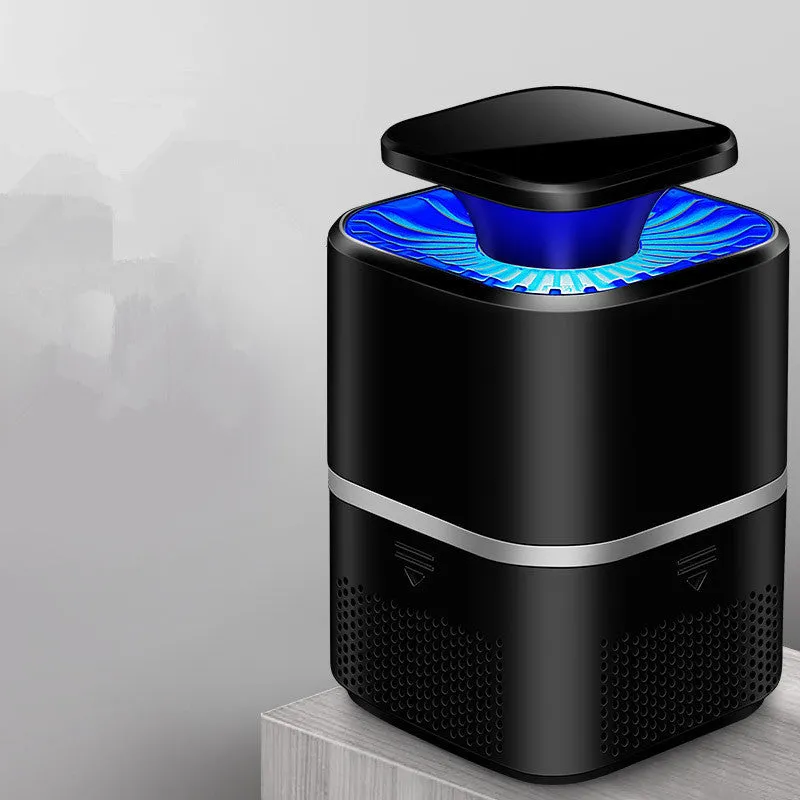 White ultimate version photocatalyst mosquito killer with blue light on a flat surface, USB cable attached