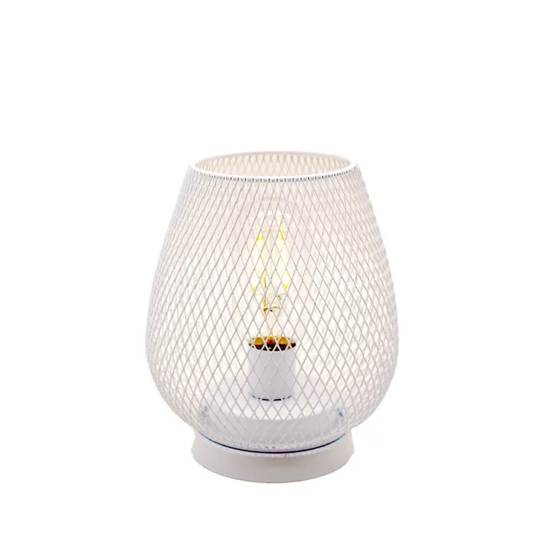 Retro iron art battery powered birdcage table lamp with warm light on bedside table