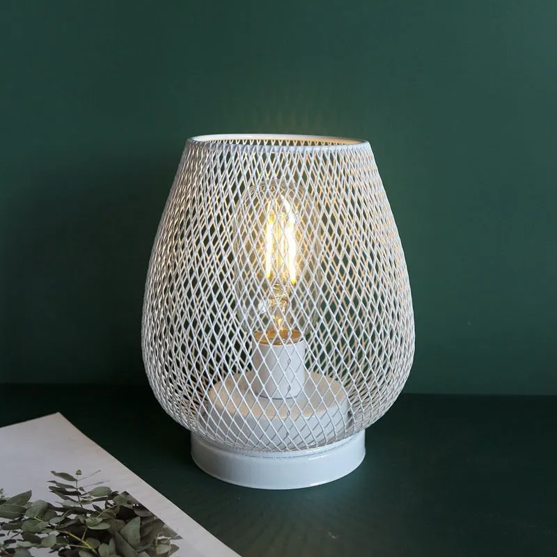 Retro iron art battery powered birdcage table lamp with warm light on bedside table