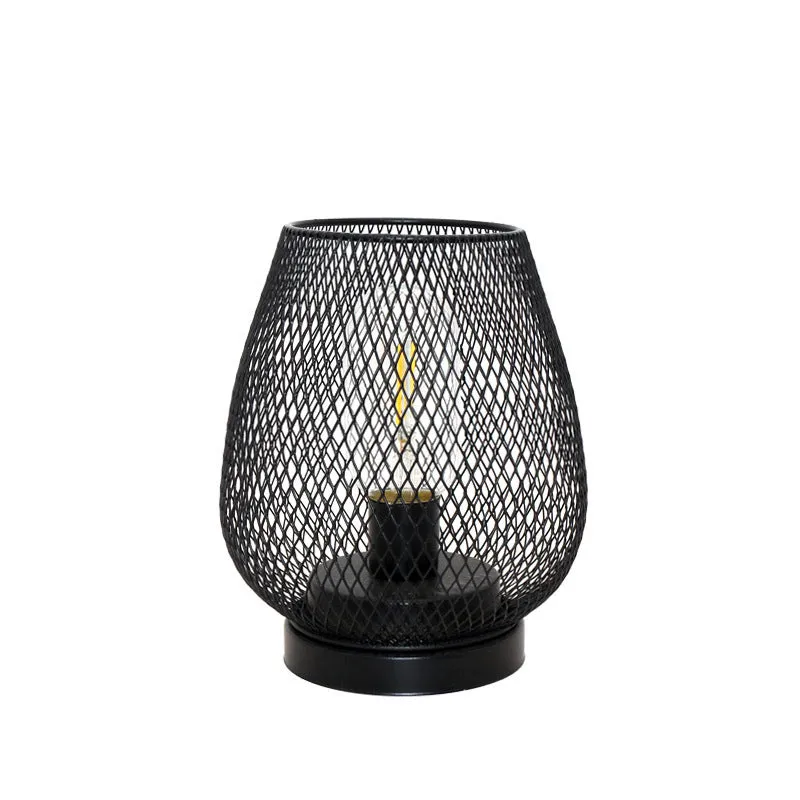 Retro iron art battery powered birdcage table lamp with warm light on bedside table