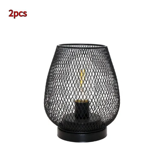 Retro iron art battery powered birdcage table lamp with warm light on bedside table