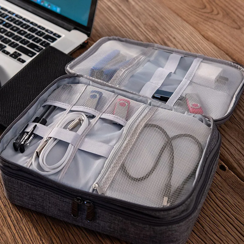 Gray waterproof double-layer electronics organizer bag with adjustable dividers and carrying handle, open to show elastic loops and mesh pockets