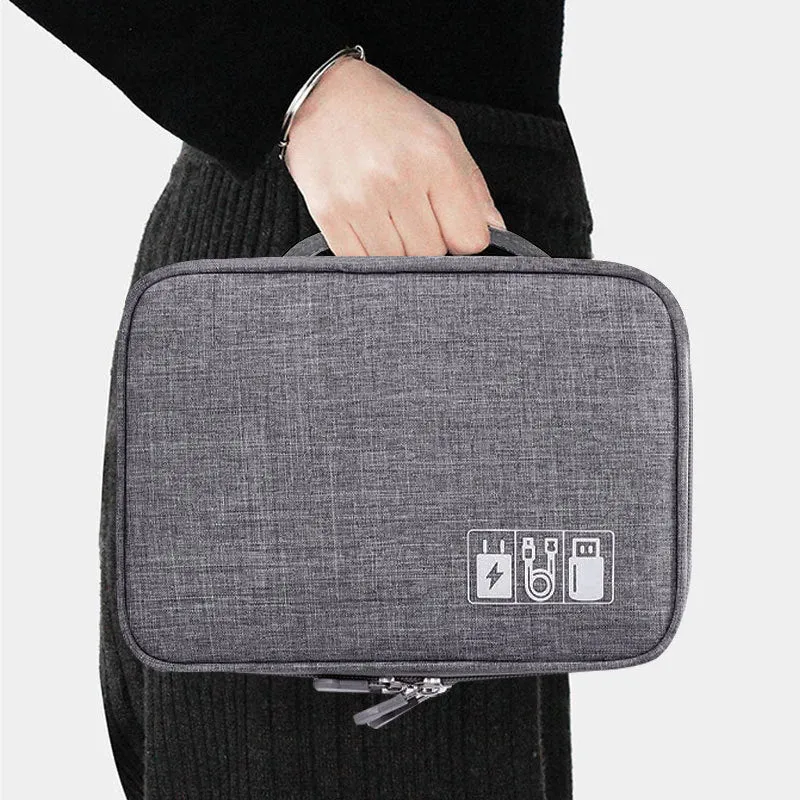 Gray waterproof double-layer electronics organizer bag with adjustable dividers and carrying handle, open to show elastic loops and mesh pockets