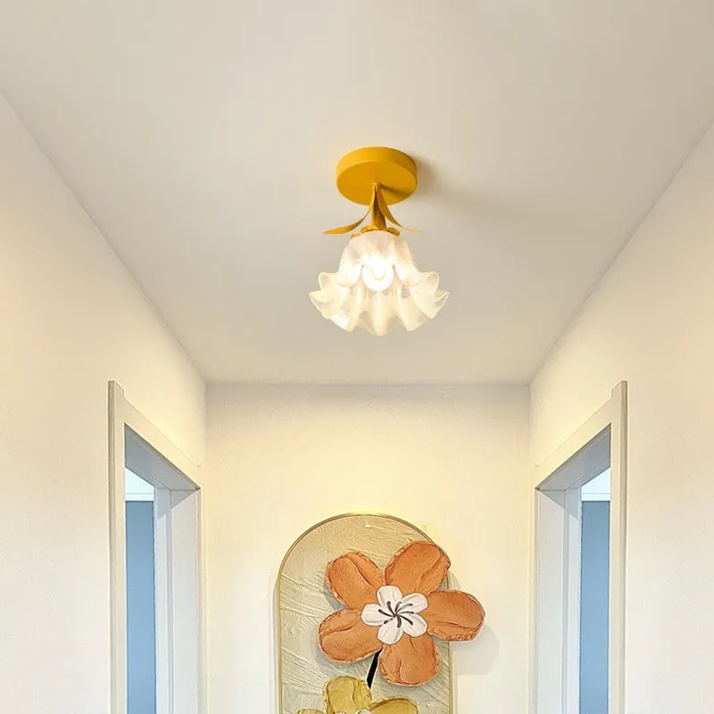 Cream coloured Linglan flower inspired corridor wall light with modern simple design on a white background.