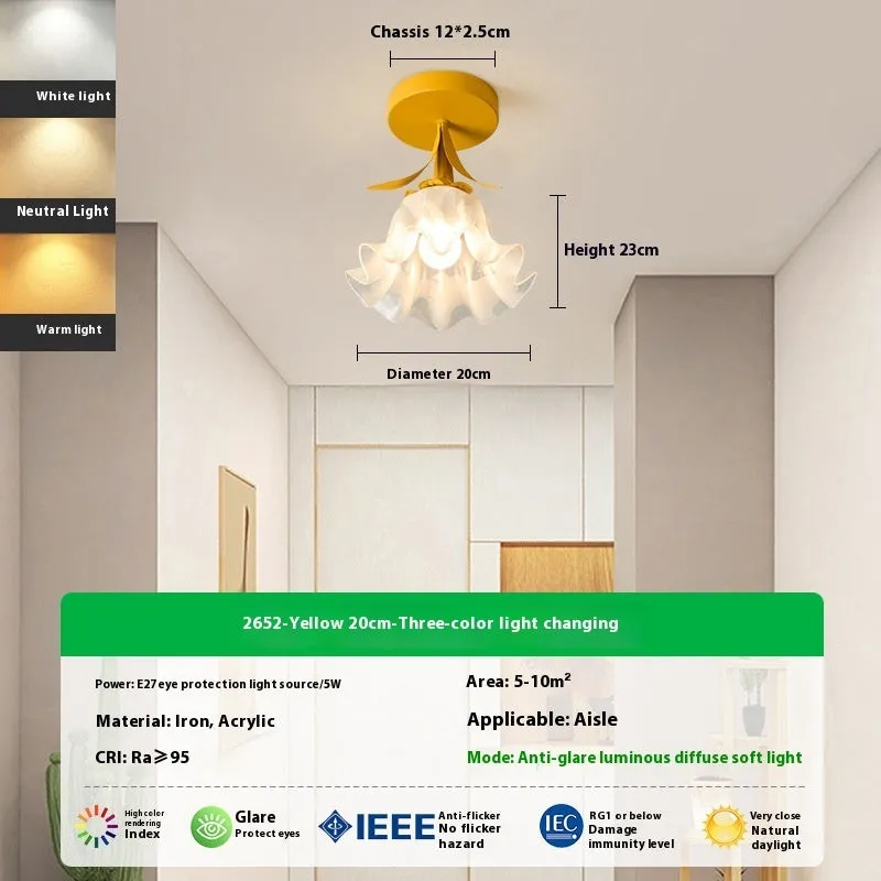 Cream coloured Linglan flower inspired corridor wall light with modern simple design on a white background.