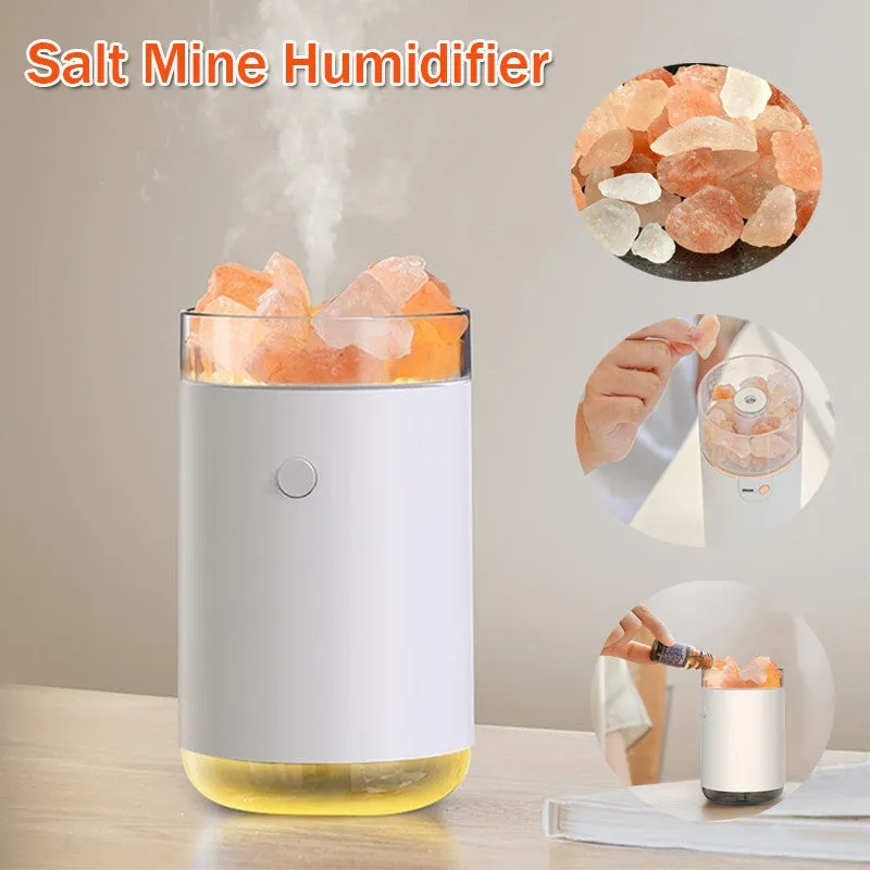 White desktop ultrasonic humidifier with crystal salt stone and LED lamp showing side view on table
