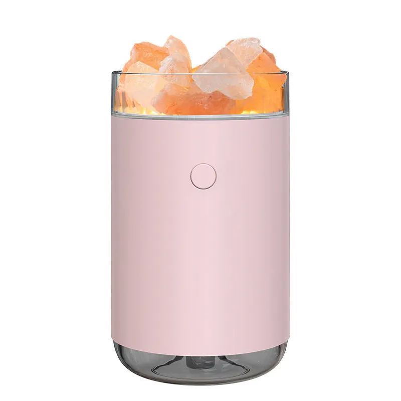 White desktop ultrasonic humidifier with crystal salt stone and LED lamp showing side view on table