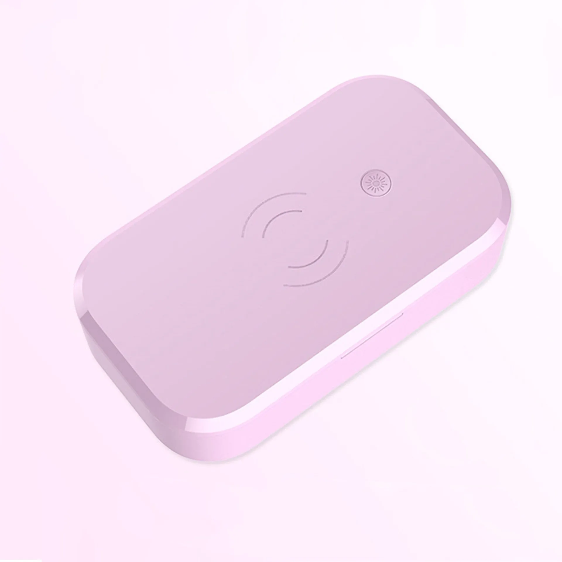 White ultraviolet disinfection box with wireless phone charging pad on top.