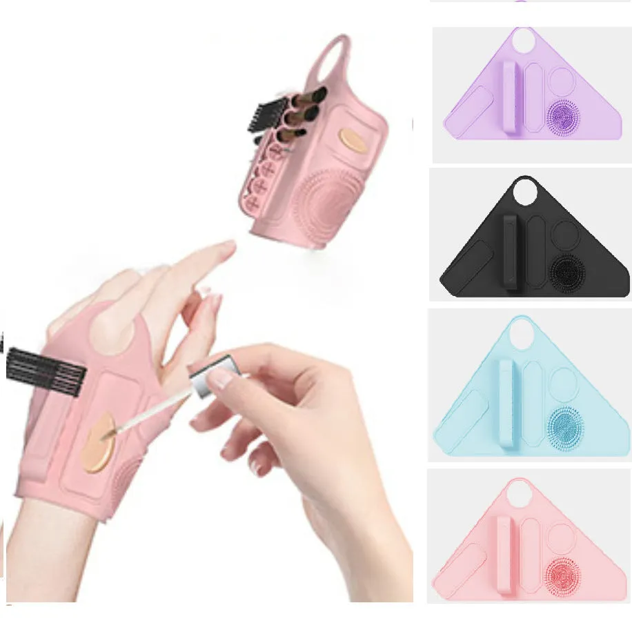Silicone makeup hand strap in purple on a hand holding a makeup brush