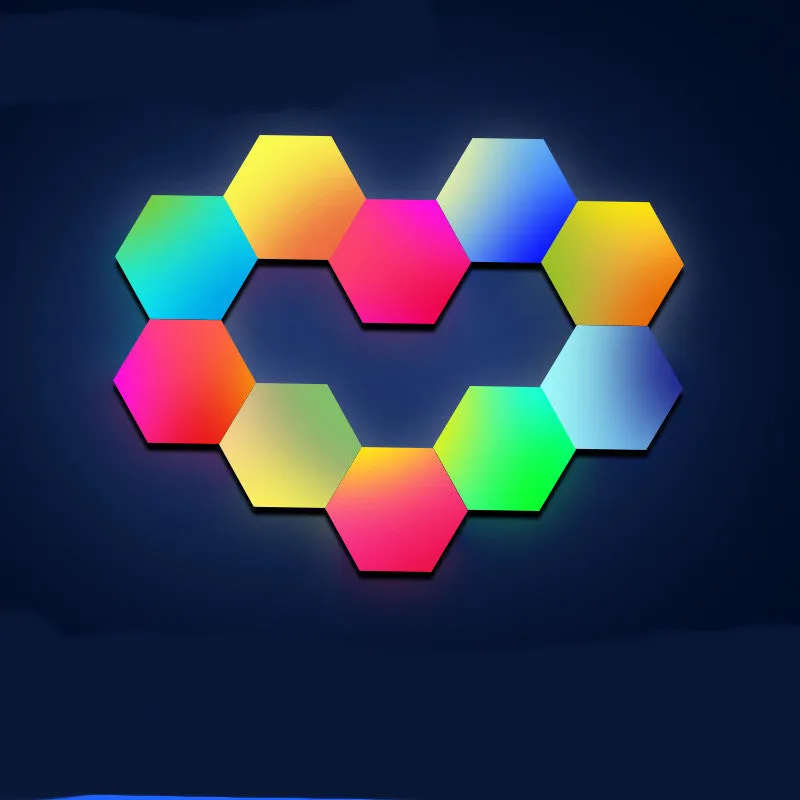 Colourful hexagonal LED wall lamp with remote control displaying rainbow effect on a bedroom wall