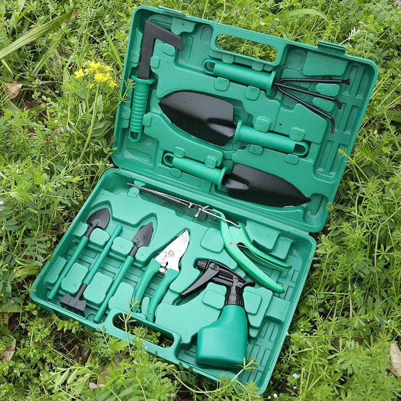 Ten-piece gardening tool set with iron heads and green plastic handles on a wooden background