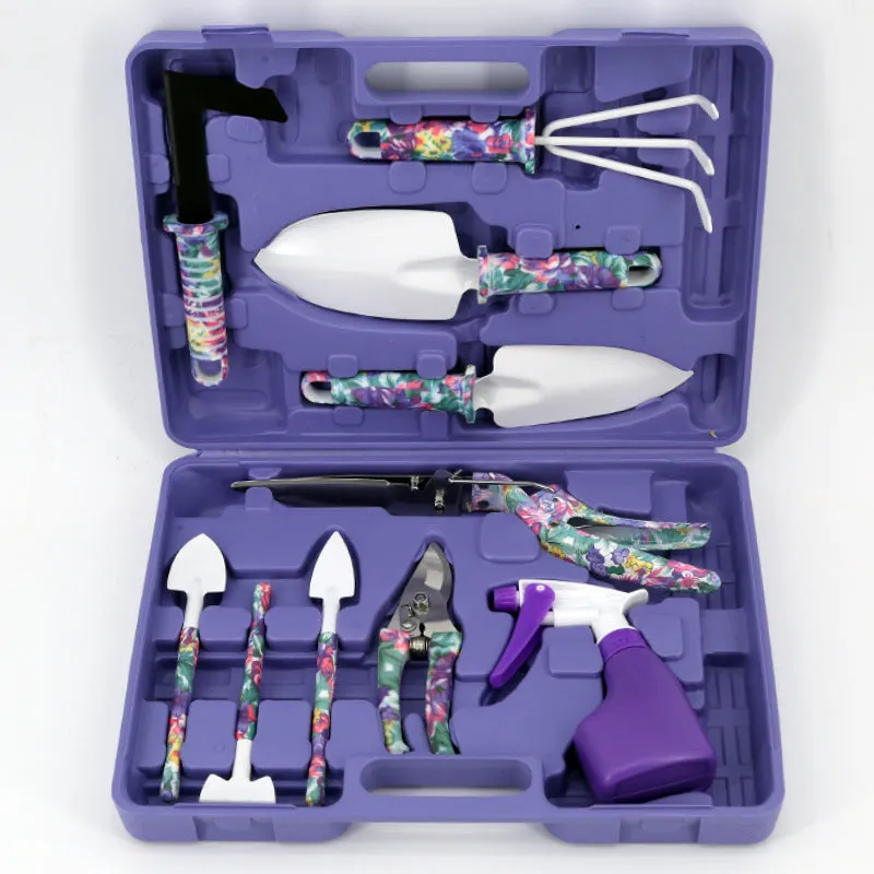 Ten-piece gardening tool set with iron heads and green plastic handles on a wooden background