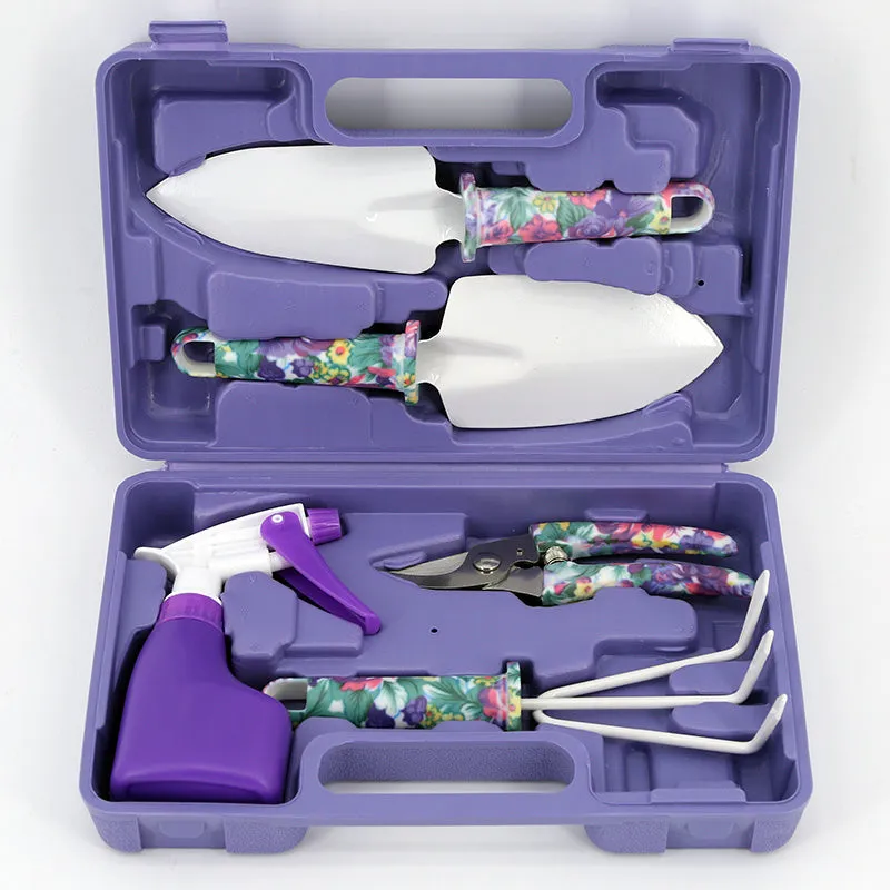 Ten-piece gardening tool set with iron heads and green plastic handles on a wooden background