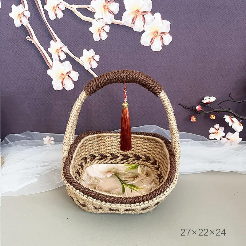 Small hand-woven straw storage basket in brown, measuring 19cm wide.