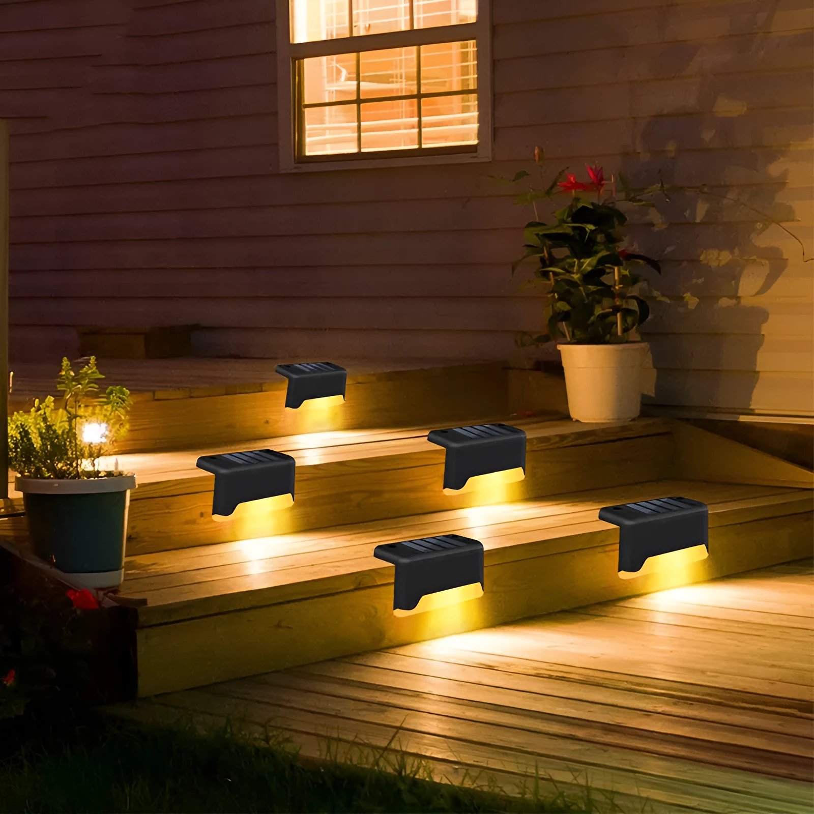 Black solar stair light with ABS housing on outdoor steps, 75x44x42mm IP55 rated