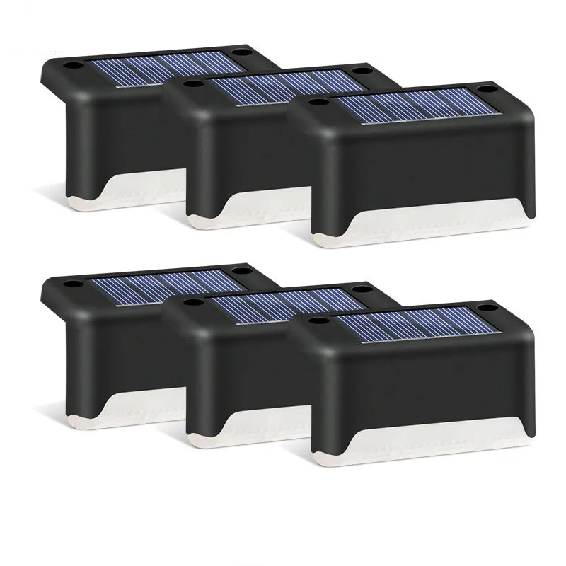 Black solar stair light with ABS housing on outdoor steps, 75x44x42mm IP55 rated