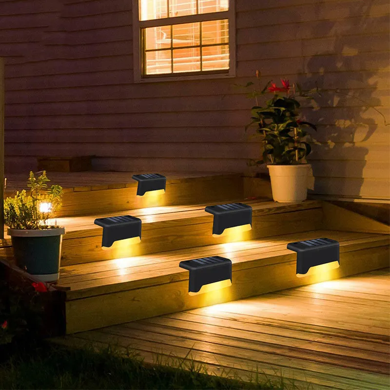 Black solar stair light with ABS housing on outdoor steps, 75x44x42mm IP55 rated