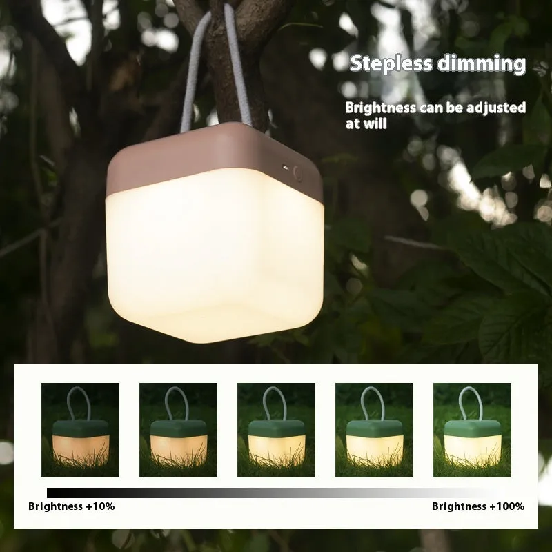 LED hanger solid color portable rechargeable light in green with remote control on a table