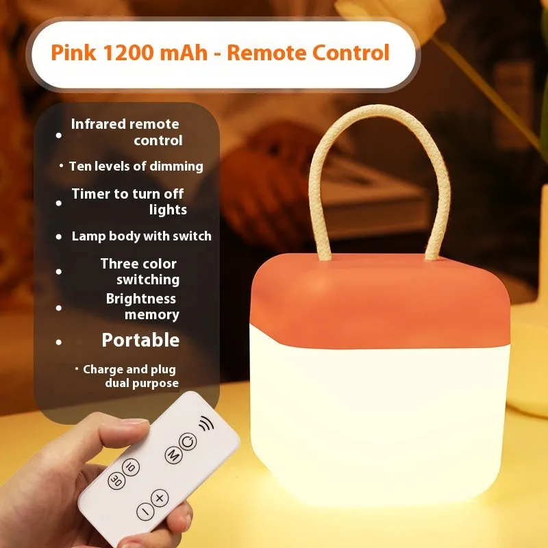 LED hanger solid color portable rechargeable light in green with remote control on a table