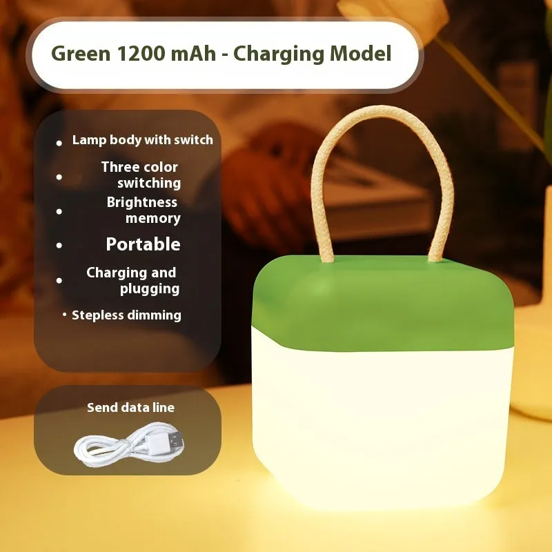 LED hanger solid color portable rechargeable light in green with remote control on a table