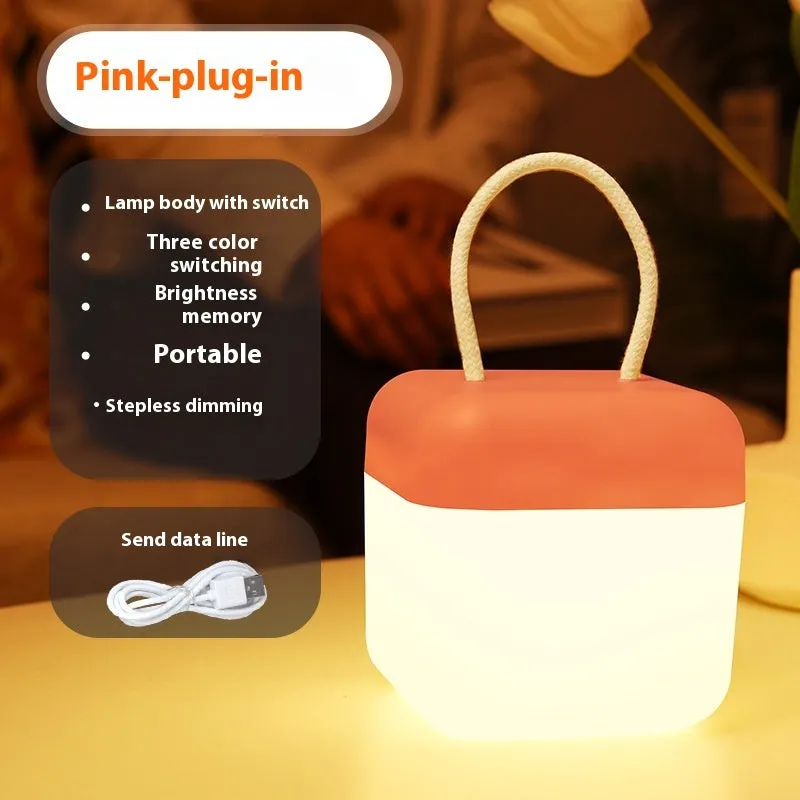 LED hanger solid color portable rechargeable light in green with remote control on a table