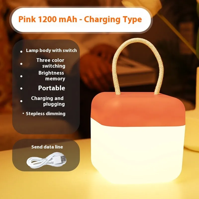LED hanger solid color portable rechargeable light in green with remote control on a table
