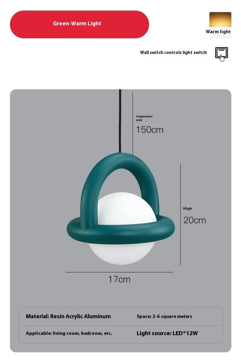 Matte black hanging line lamp with a long black cord suspended above a bedside table.