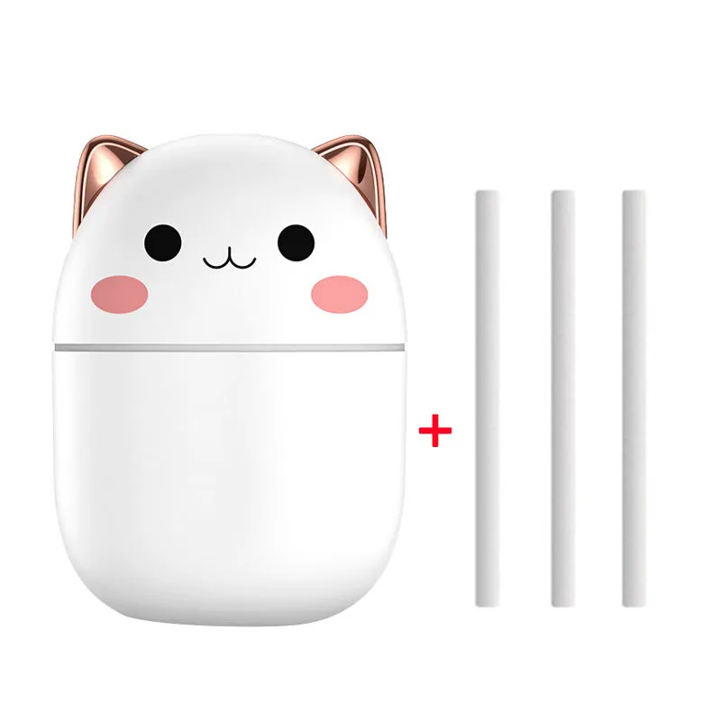 Cute cat-shaped USB air humidifier with LED cool mist spray in white, for office and bedroom use.