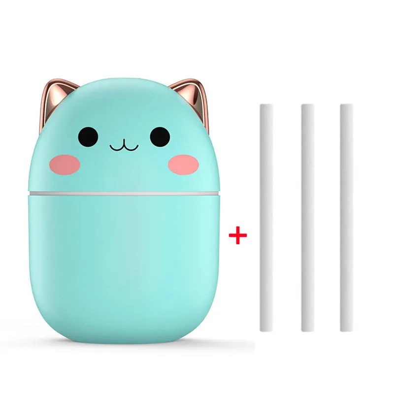 Cute cat-shaped USB air humidifier with LED cool mist spray in white, for office and bedroom use.