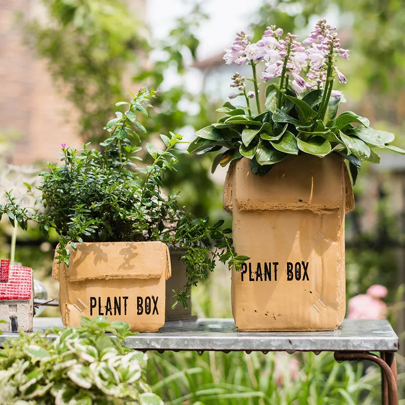 Cement flowerpot with perforated base and Nordic brown paper box design