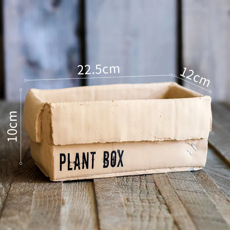 Cement flowerpot with perforated base and Nordic brown paper box design