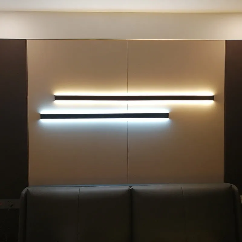 Black minimalist bedside wall lamp in 40cm to 200cm lengths with three light colour options on a wall